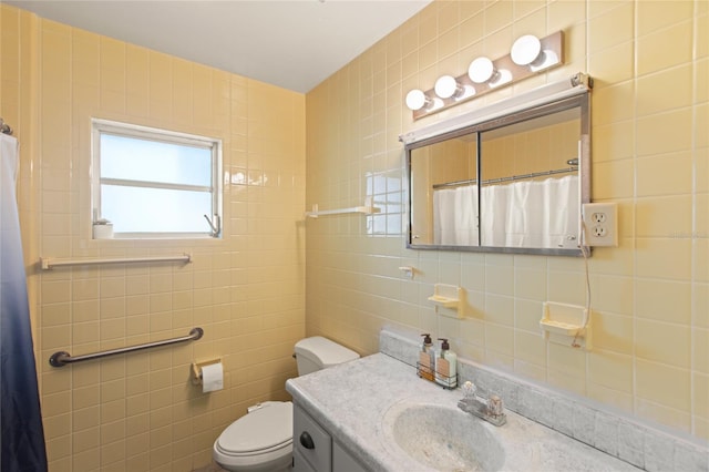 bathroom featuring vanity, toilet, a shower with shower curtain, and tile walls