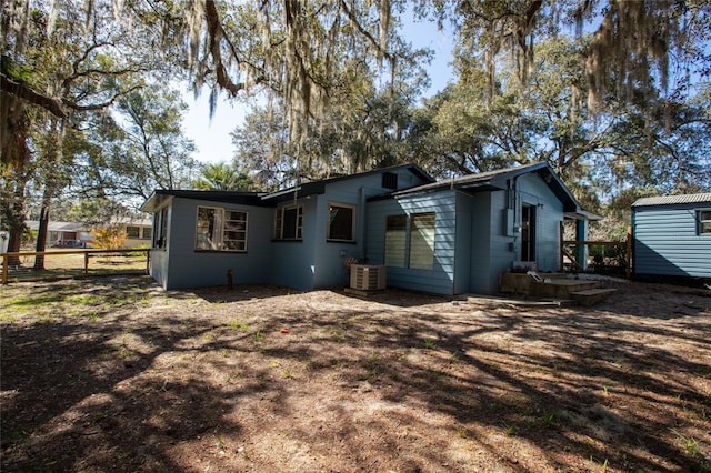 back of house with cooling unit