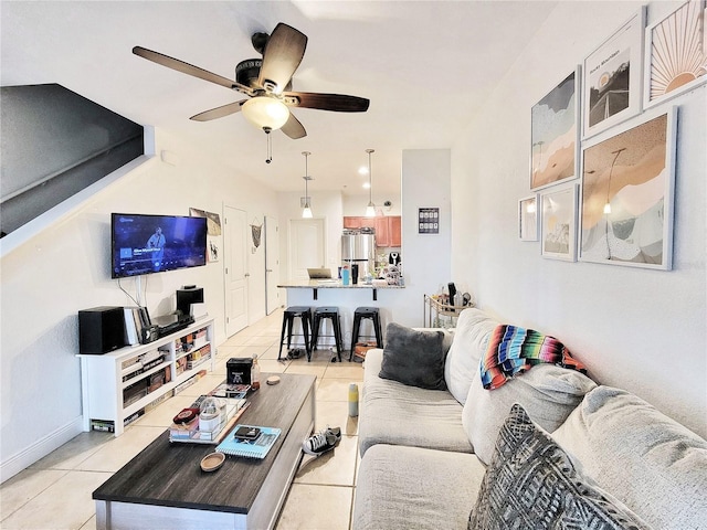 living room with light tile patterned floors and ceiling fan