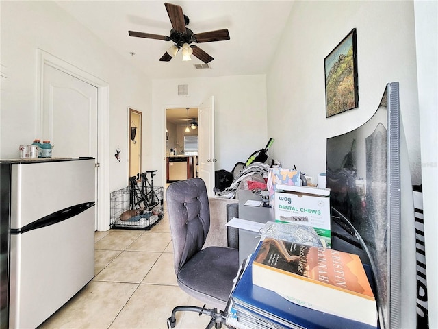 office space featuring light tile patterned flooring and ceiling fan