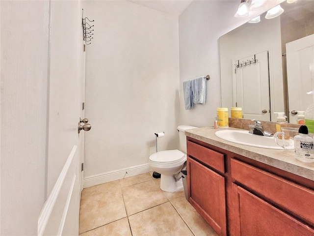 bathroom featuring tile patterned floors, toilet, and vanity