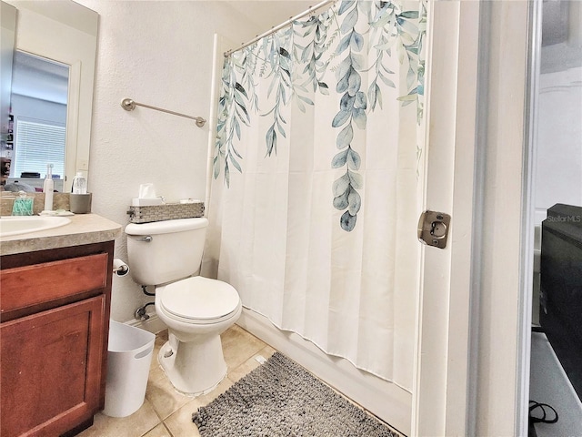 full bathroom with shower / tub combo with curtain, vanity, toilet, and tile patterned flooring