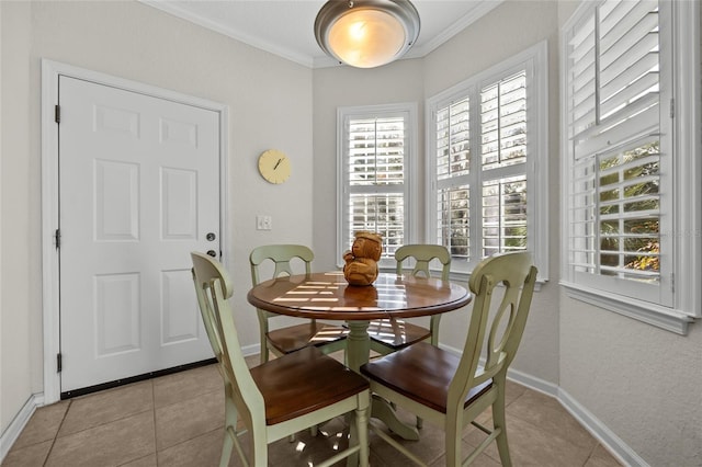 tiled dining space featuring ornamental molding