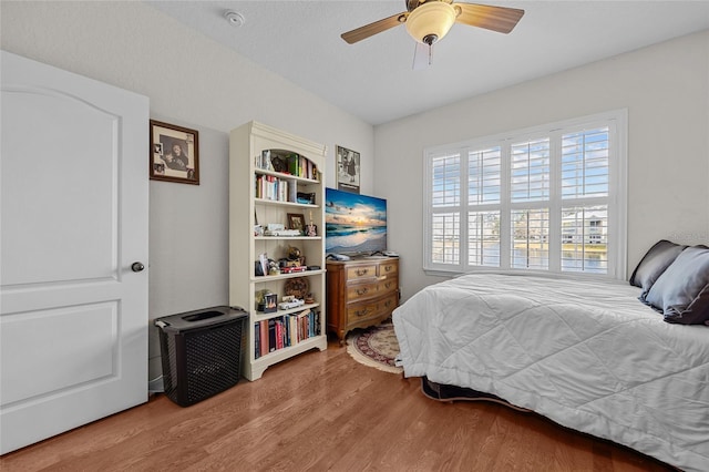 bedroom featuring hardwood / wood-style flooring and ceiling fan