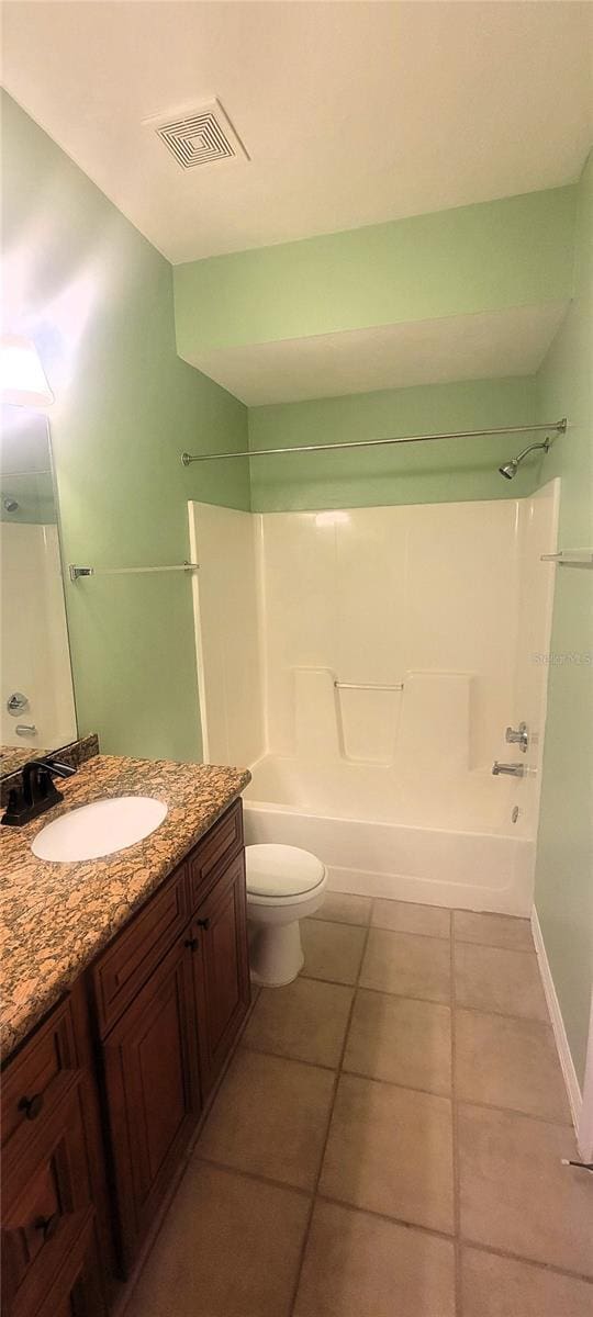 full bathroom with vanity, tile patterned flooring, shower / washtub combination, and toilet