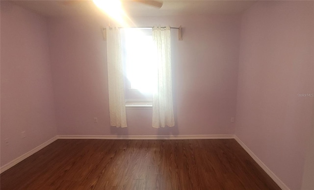 empty room featuring dark hardwood / wood-style floors