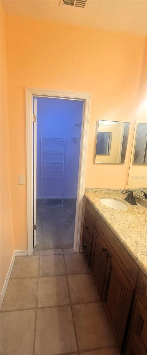 bathroom with vanity and tile patterned flooring