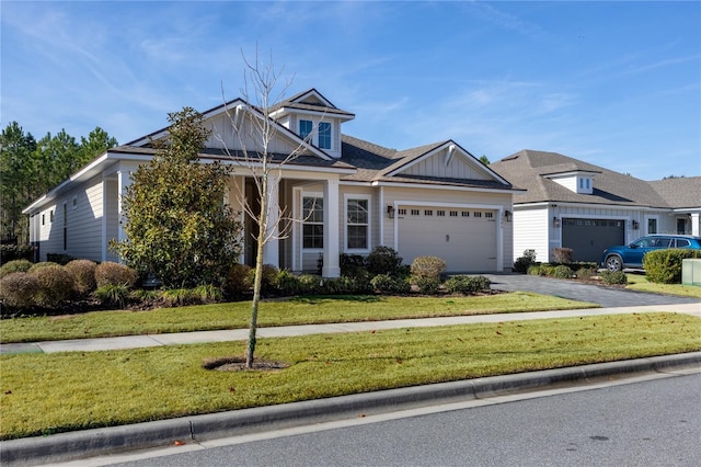 view of front facade with a garage and a front yard