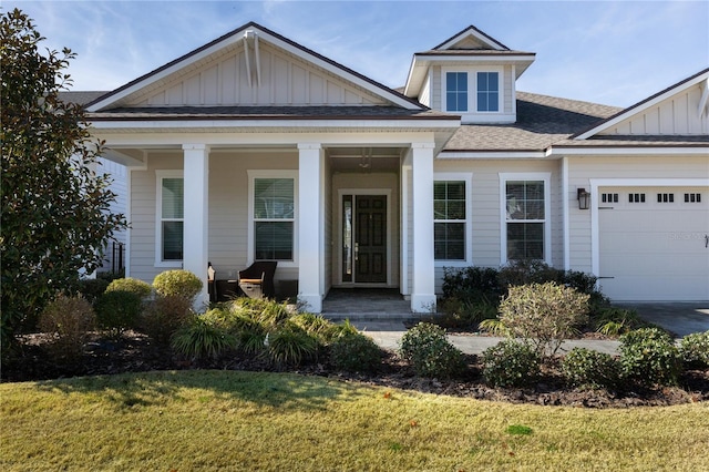 view of front facade with a garage and a front lawn