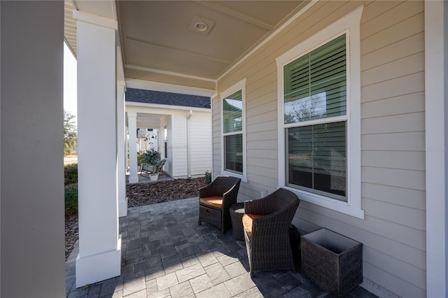 view of patio featuring a porch