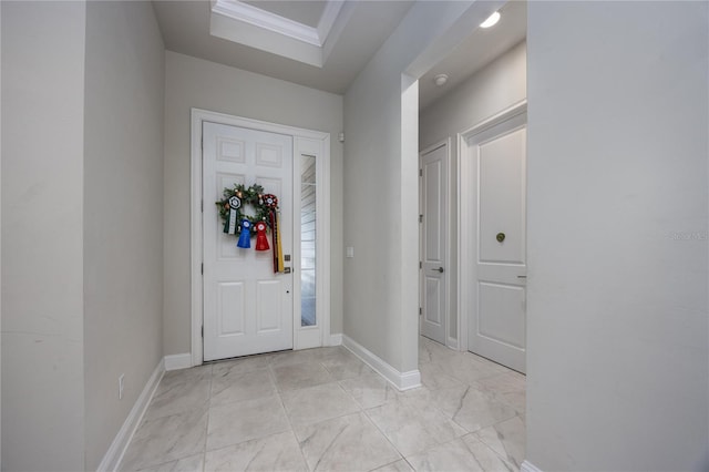 foyer featuring ornamental molding