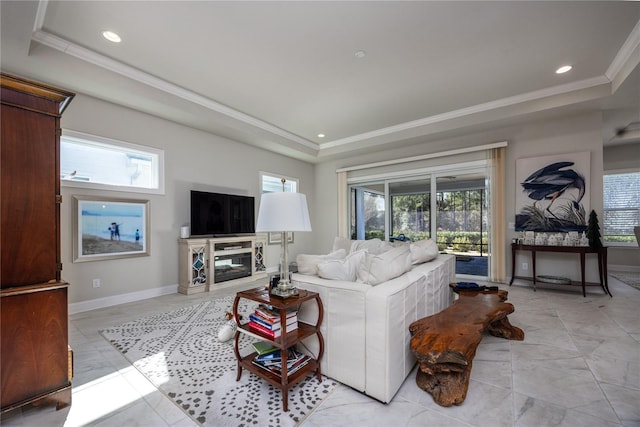 living room featuring crown molding and a tray ceiling