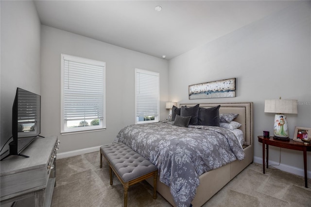 bedroom featuring light carpet