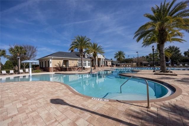 view of swimming pool with a patio