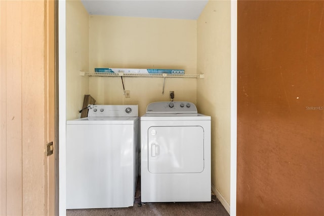 laundry room with washing machine and clothes dryer