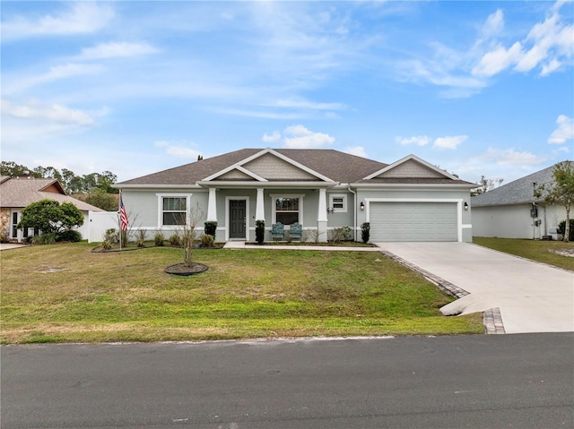 view of front facade featuring a garage and a front yard