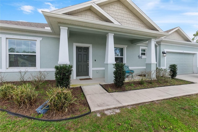 view of front of house featuring a garage and a porch