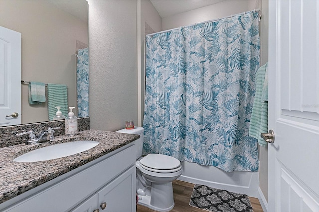 full bathroom with shower / bathtub combination with curtain, wood-type flooring, toilet, and vanity