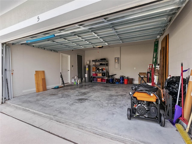 garage featuring electric water heater and electric panel