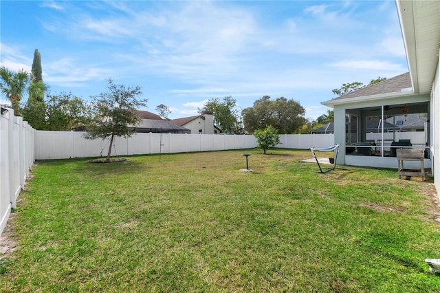 view of yard with a sunroom