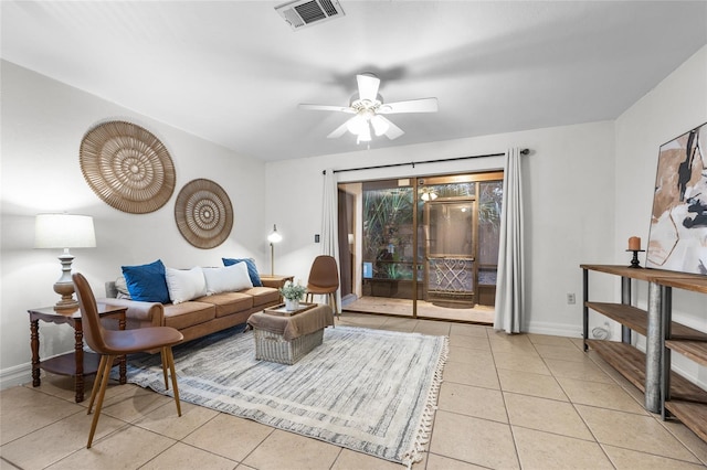 tiled living room featuring ceiling fan