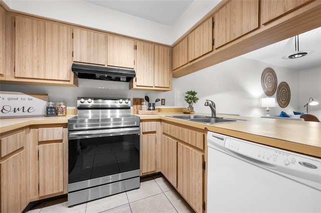 kitchen featuring stainless steel electric stove, light brown cabinetry, sink, light tile patterned floors, and white dishwasher