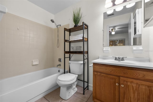 full bathroom with toilet, vanity, tiled shower / bath combo, ceiling fan, and tile patterned flooring