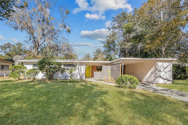 ranch-style house with a front yard and a carport