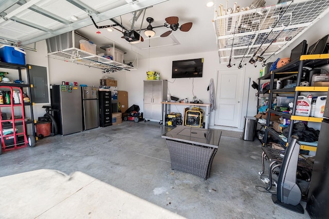 garage featuring a garage door opener, stainless steel fridge, and electric panel