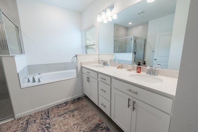 bathroom featuring independent shower and bath and vanity