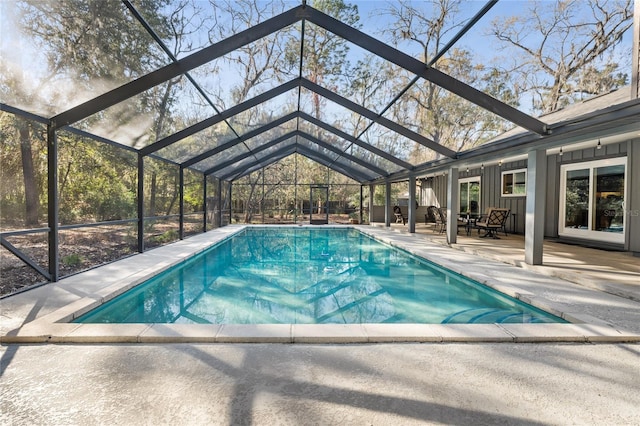 outdoor pool featuring a lanai and a patio area