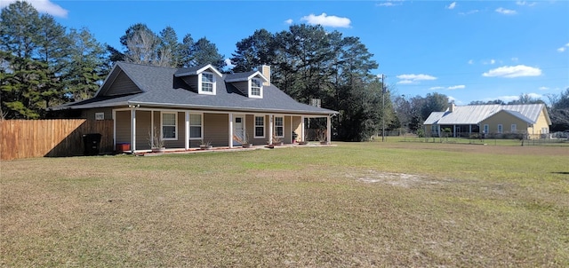 view of front of house with a front lawn and covered porch