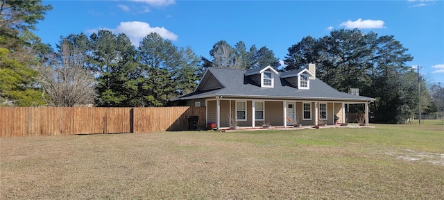 view of front facade with a front yard and covered porch