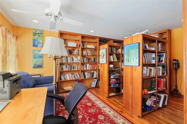 office area with light hardwood / wood-style floors and ceiling fan