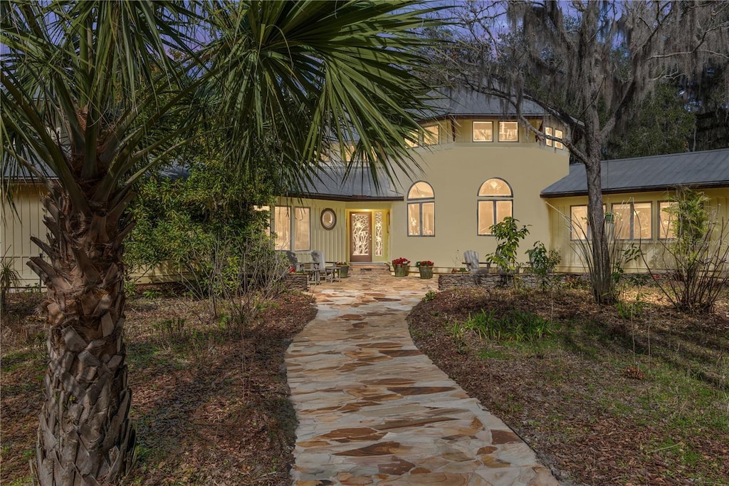 21115 SE 179th Pl, Hawthorne, FL 32640 - view of front facade with metal roof and stucco siding