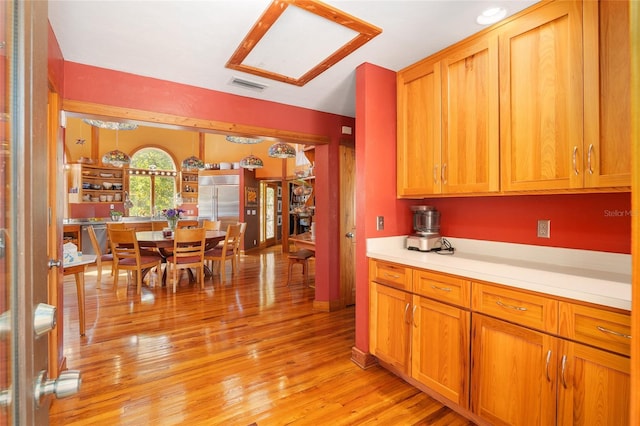 kitchen with appliances with stainless steel finishes and light wood-type flooring