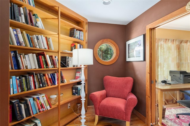 sitting room with hardwood / wood-style floors