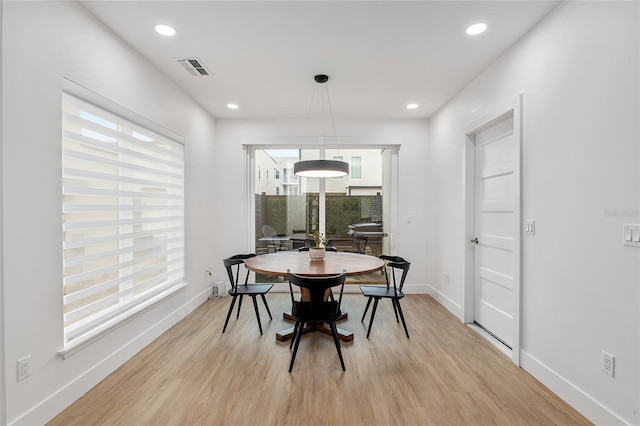 dining space featuring light hardwood / wood-style floors