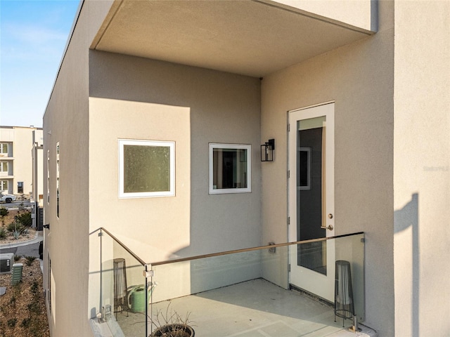 doorway to property featuring a patio area