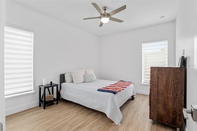 bedroom featuring light hardwood / wood-style flooring and ceiling fan