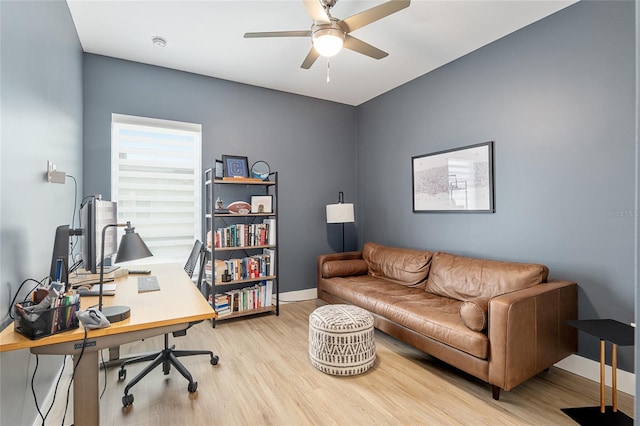 office space featuring ceiling fan and light hardwood / wood-style flooring