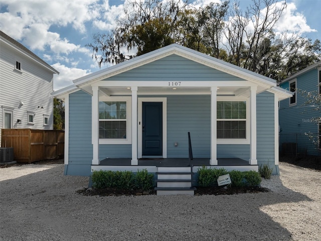 bungalow-style home featuring central AC unit and covered porch