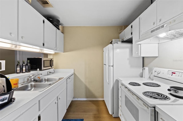 kitchen with dark hardwood / wood-style floors, white cabinetry, sink, and white appliances