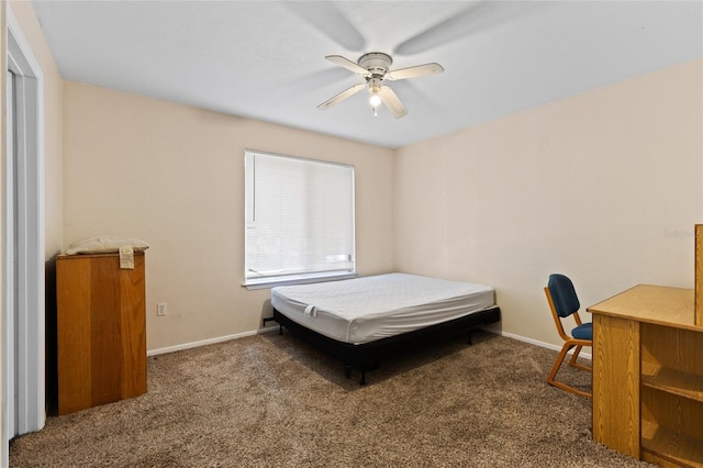 bedroom with ceiling fan and dark carpet