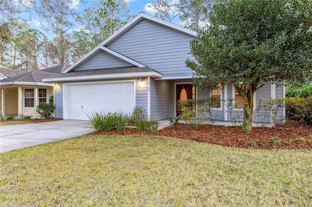 view of front of property with a garage and a front yard