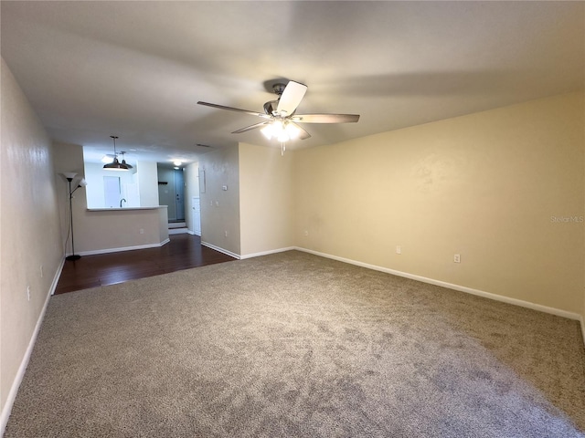 carpeted empty room with ceiling fan