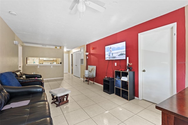 living room featuring ceiling fan and tile patterned flooring