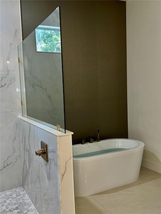 bathroom featuring separate shower and tub