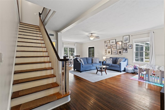 living room featuring hardwood / wood-style flooring and ceiling fan