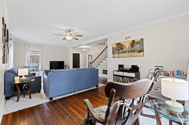 dining area with wood-type flooring, ornamental molding, and ceiling fan